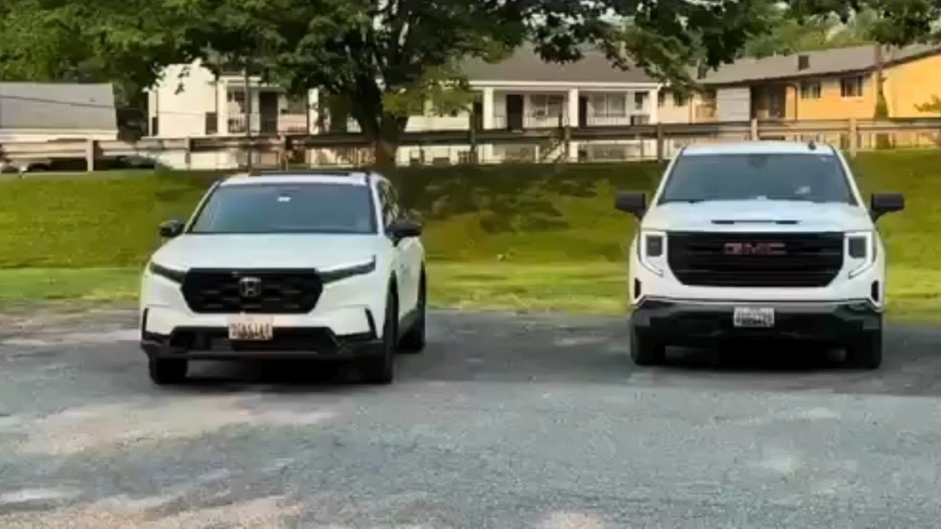 Two white ServicePros service SUVs parked outdoors